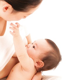 Mother breastfeeding baby