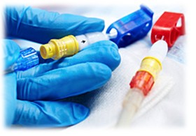 Nurse with blue clinical gloves drawing CVC