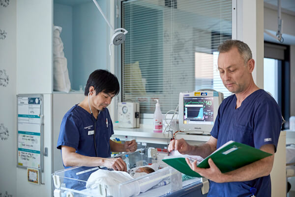 A baby is cared for in the Neonatal Intensive Care Unit