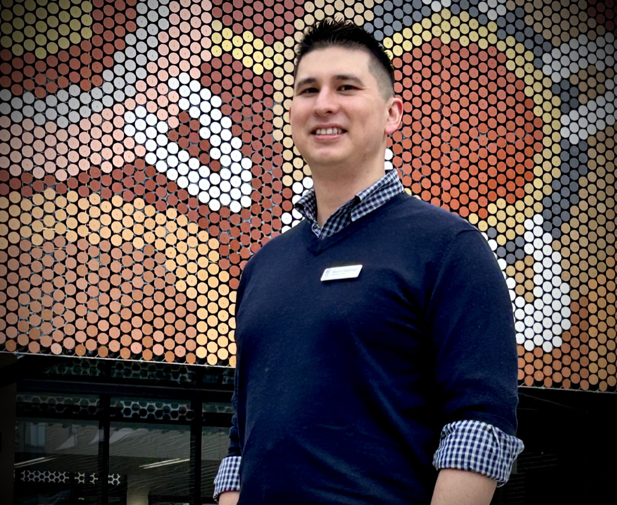 ICU Specialist Jason Chapman standing in front of Building 5 at Canberra Hospital