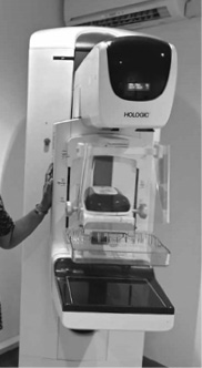 Mammography machine with compression plate used for breast screening