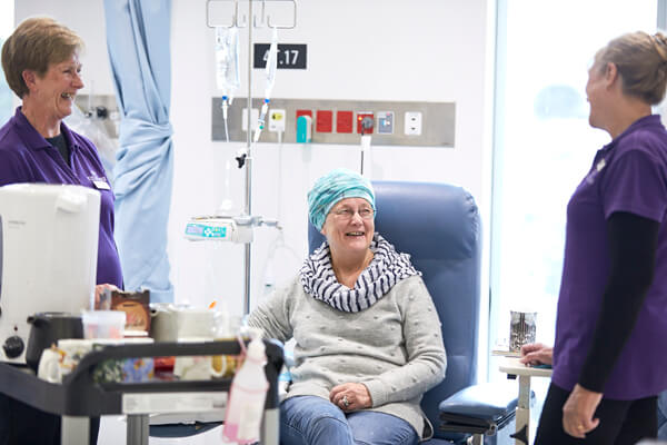 A chat and a cup of tea with our volunteers tea trolley Volunteers bring a tea trolley to patients receiving cancer treatment