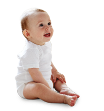 A six month old toddler is sitting up.