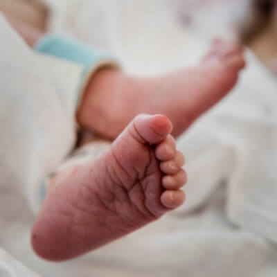 Close up of tiny newborn baby feet