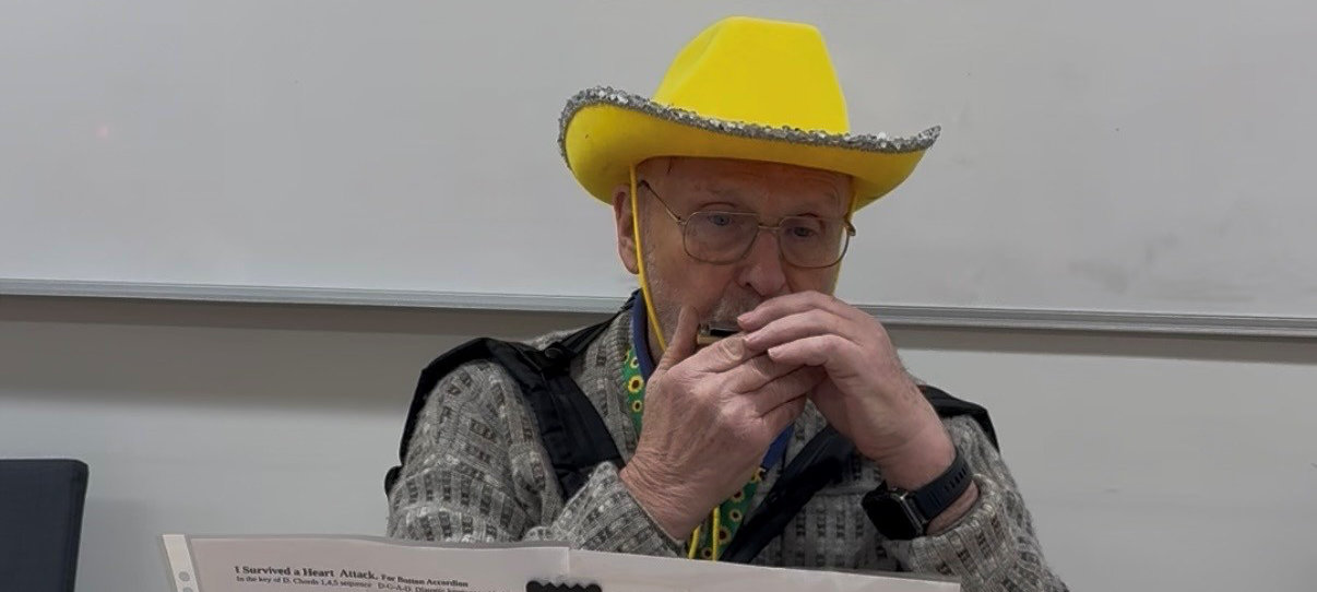 Local artist Anders Mykkeltvedt playing a harmonica