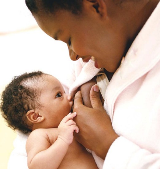 Mother expressing milk for toddler