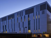 Exterior of the Canberra Regional Cancer Centre, a modern multi-storey healthcare building, photographed in the evening.